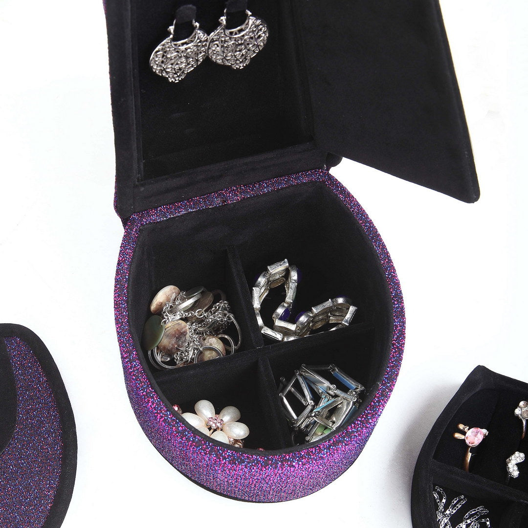 Purple glitter jewelry box filled with necklaces and bracelets