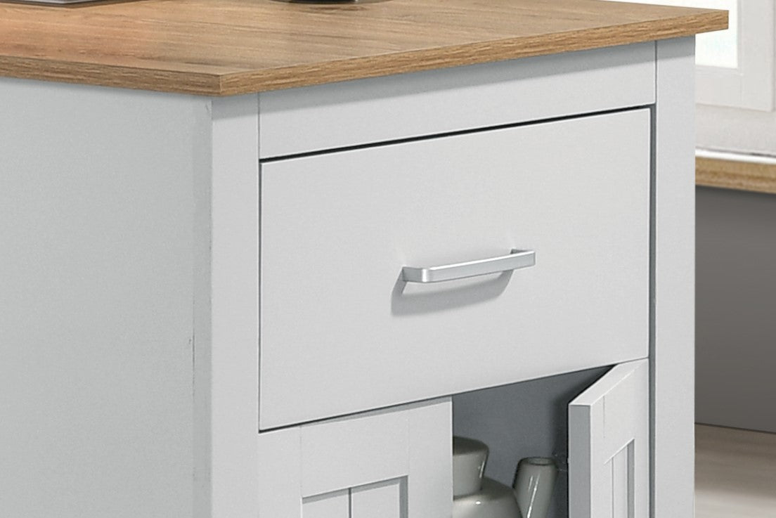 White kitchen cabinet with wood top and silver drawer pull