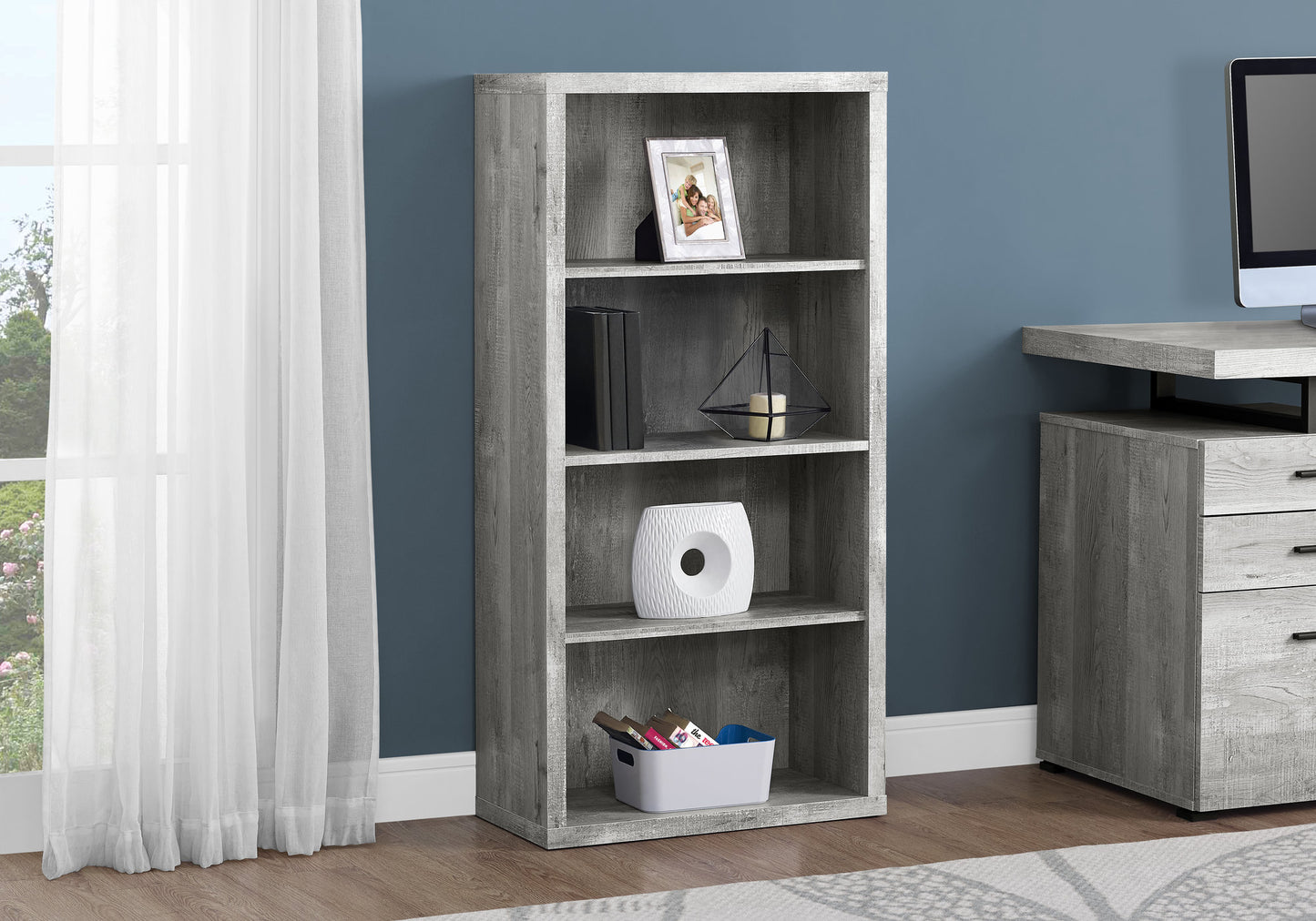 Grey wood fourshelf bookshelf with decorative items and books