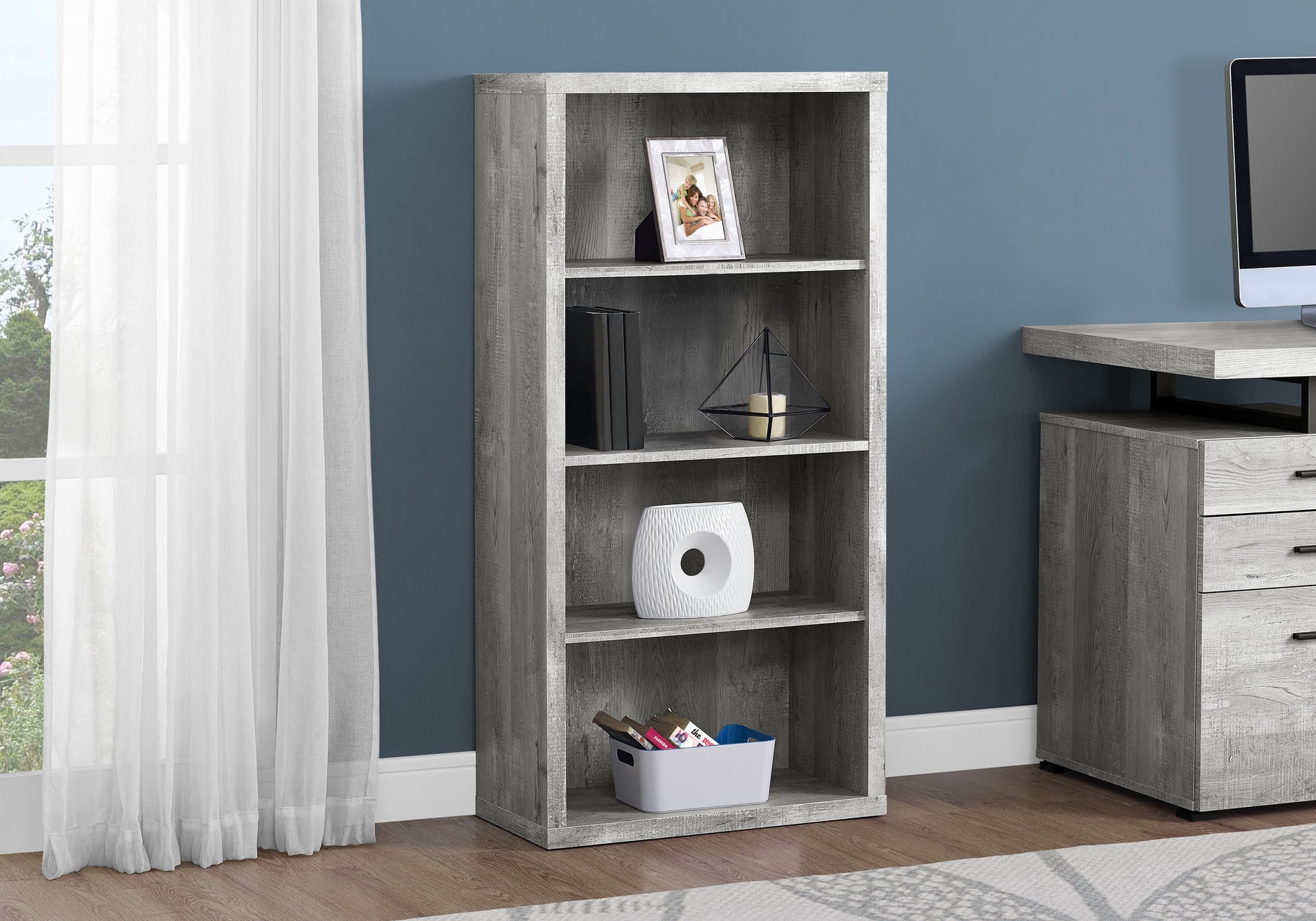 Grey wood fourshelf bookshelf with decorative items and books