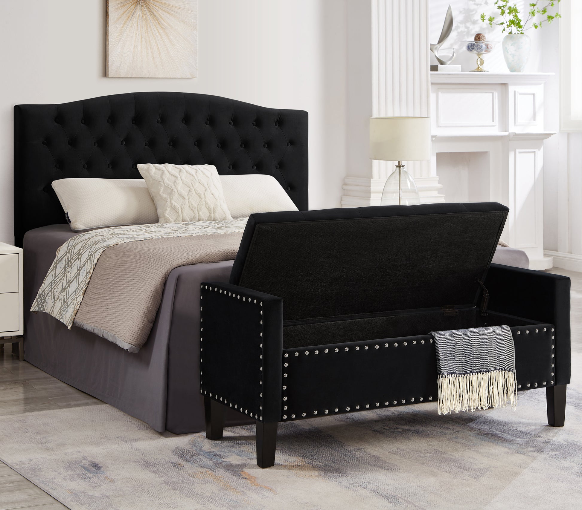 Black velvet storage bench with silver nailhead trim and open storage
