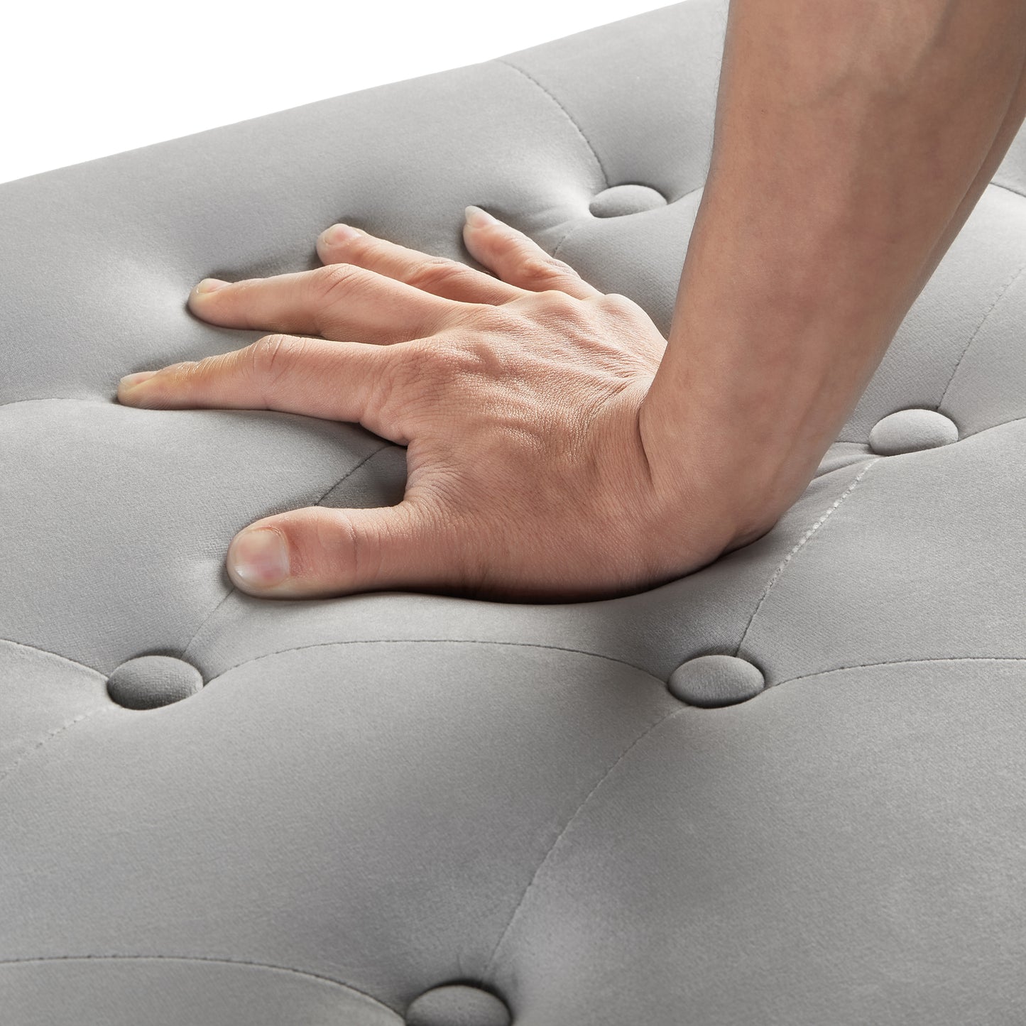 Light grey velvet ottoman with tufted detail