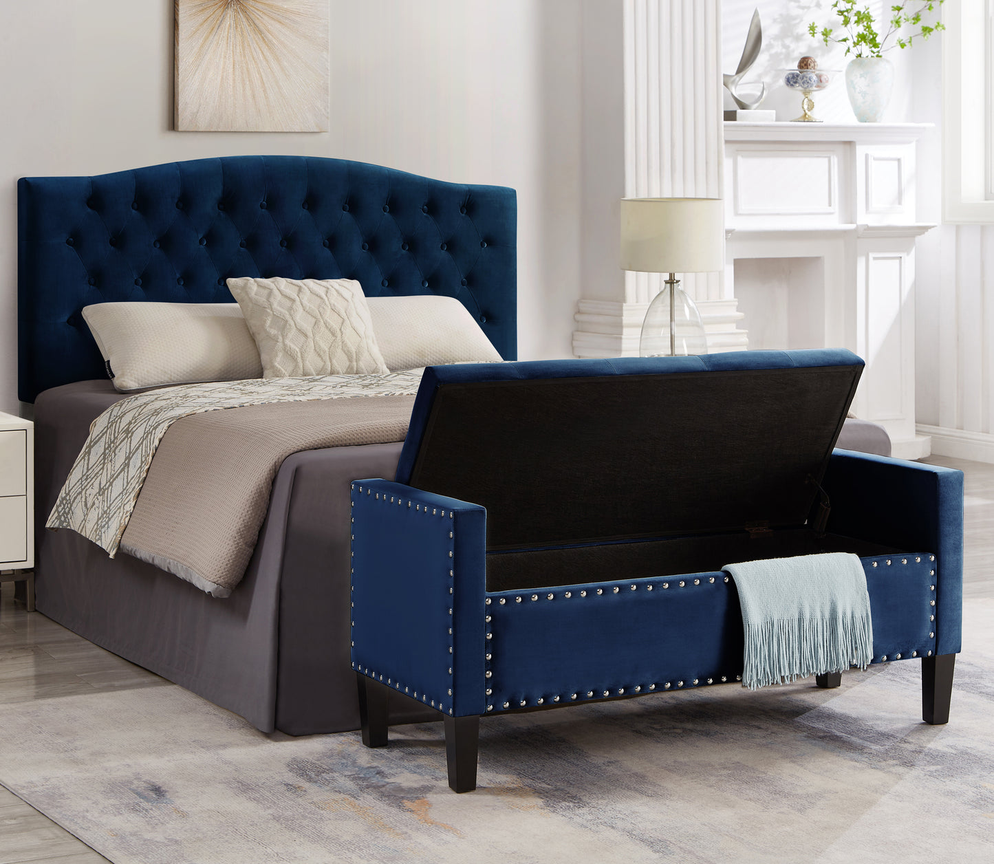 Navy blue velvet storage bench with silver nailhead trim