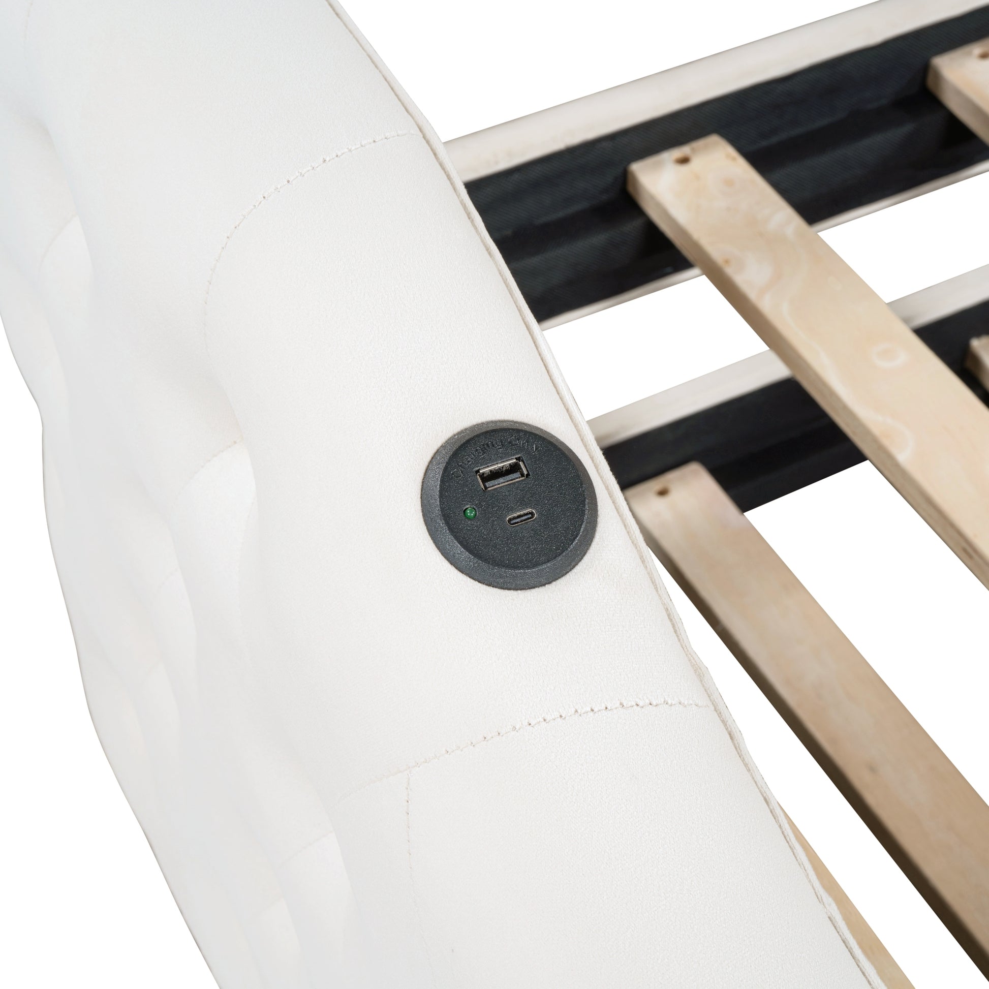 White upholstered bed frame with integrated USB charging ports
