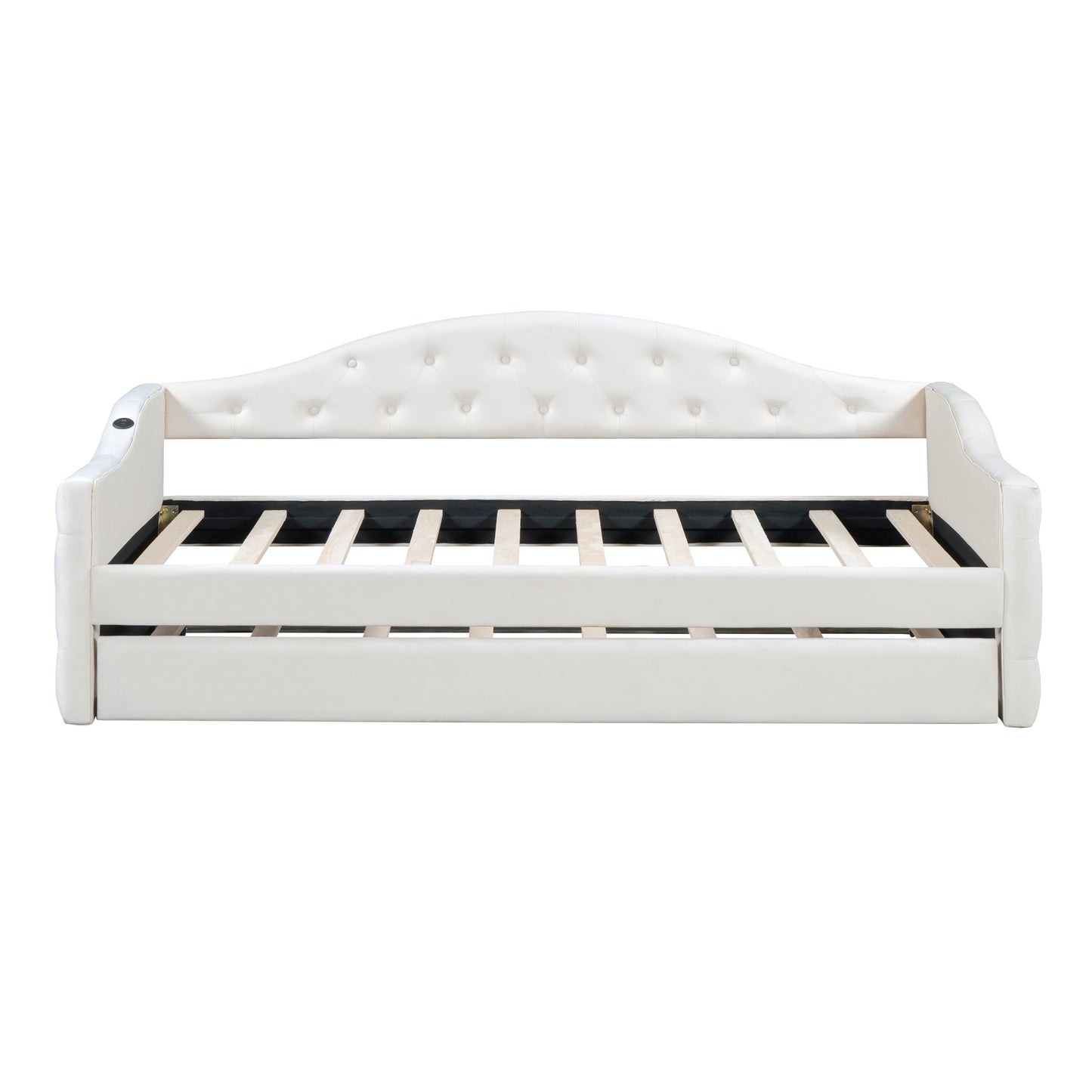 White upholstered daybed with tufted back and pullout trundle
