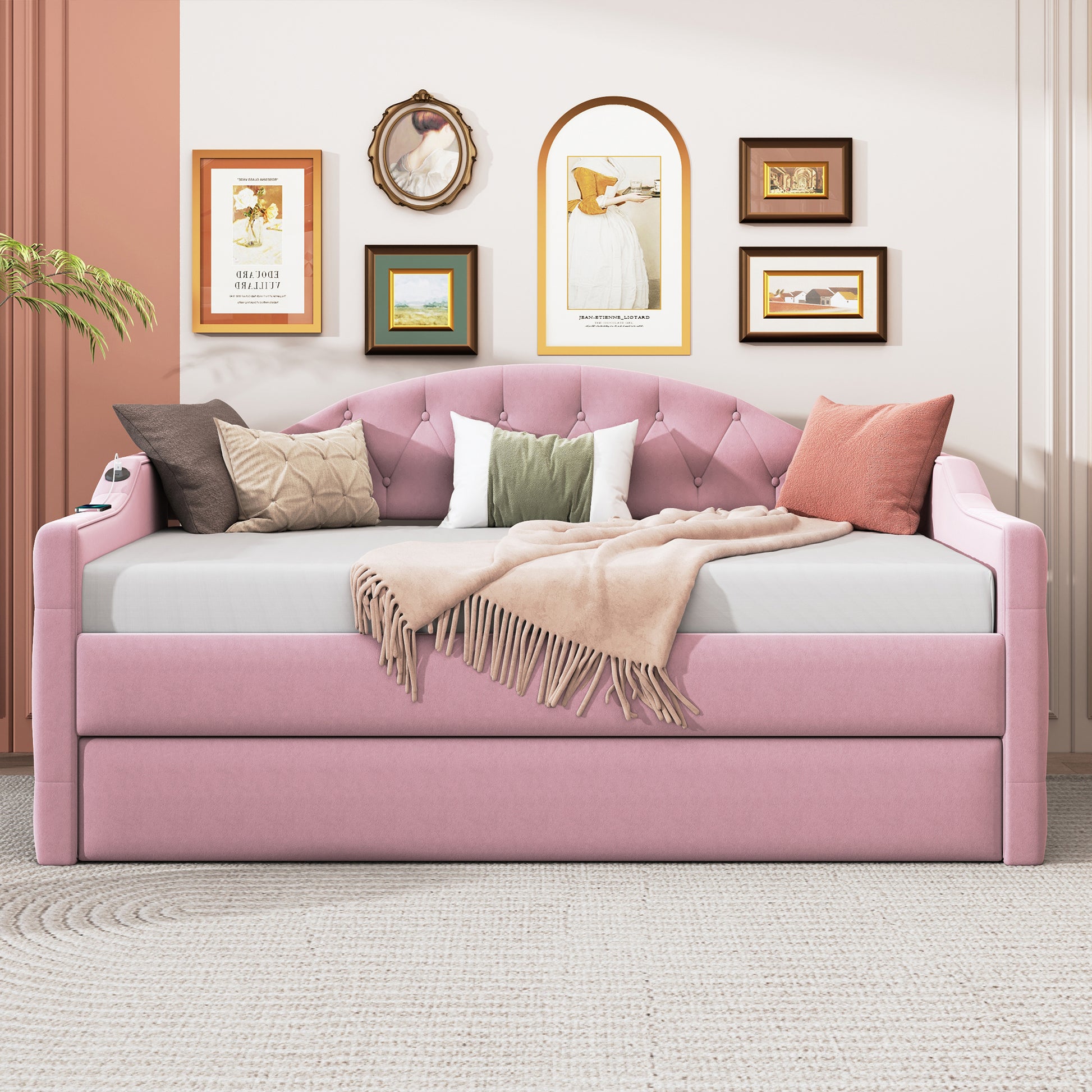 Pink velvet daybed with tufted back and integrated charging station