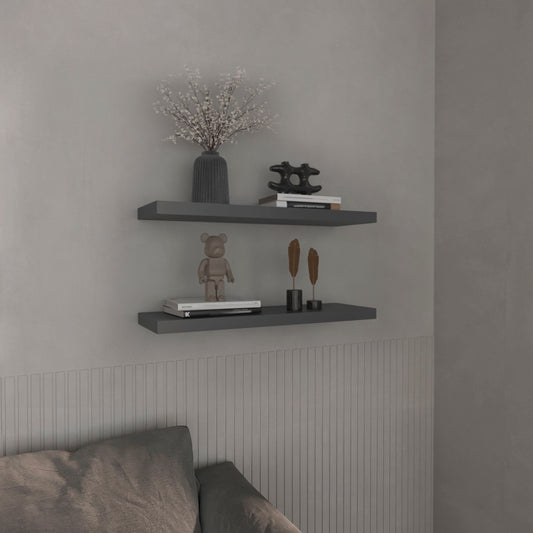 Grey modern floating shelf with decorative vase and abstract sculpture
