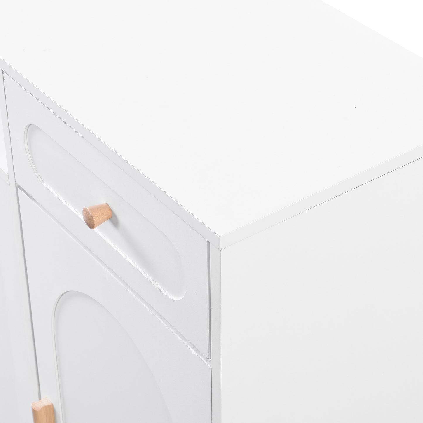 White dresser with arched drawer fronts and natural wood knobs