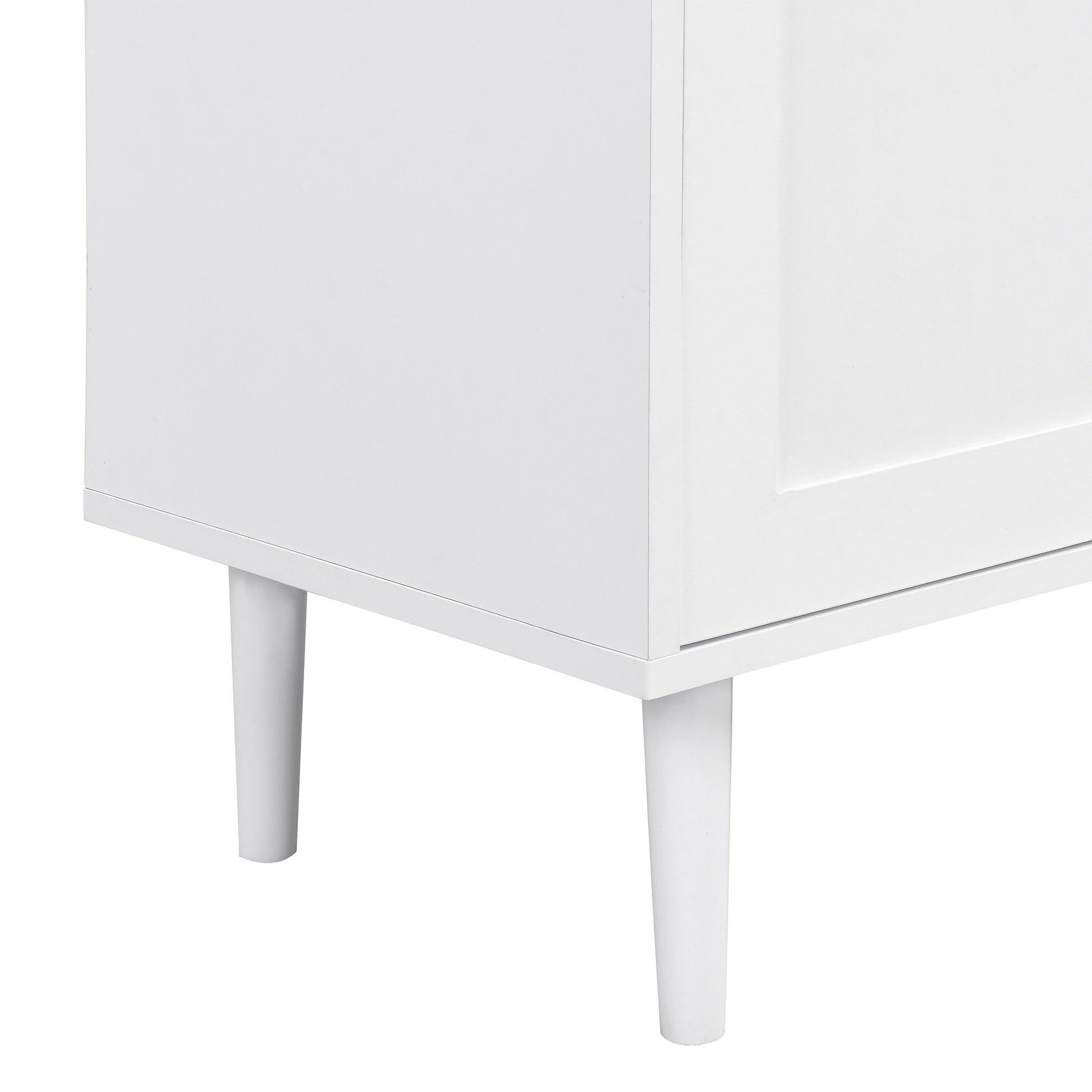Closeup of white cabinet with tapered legs