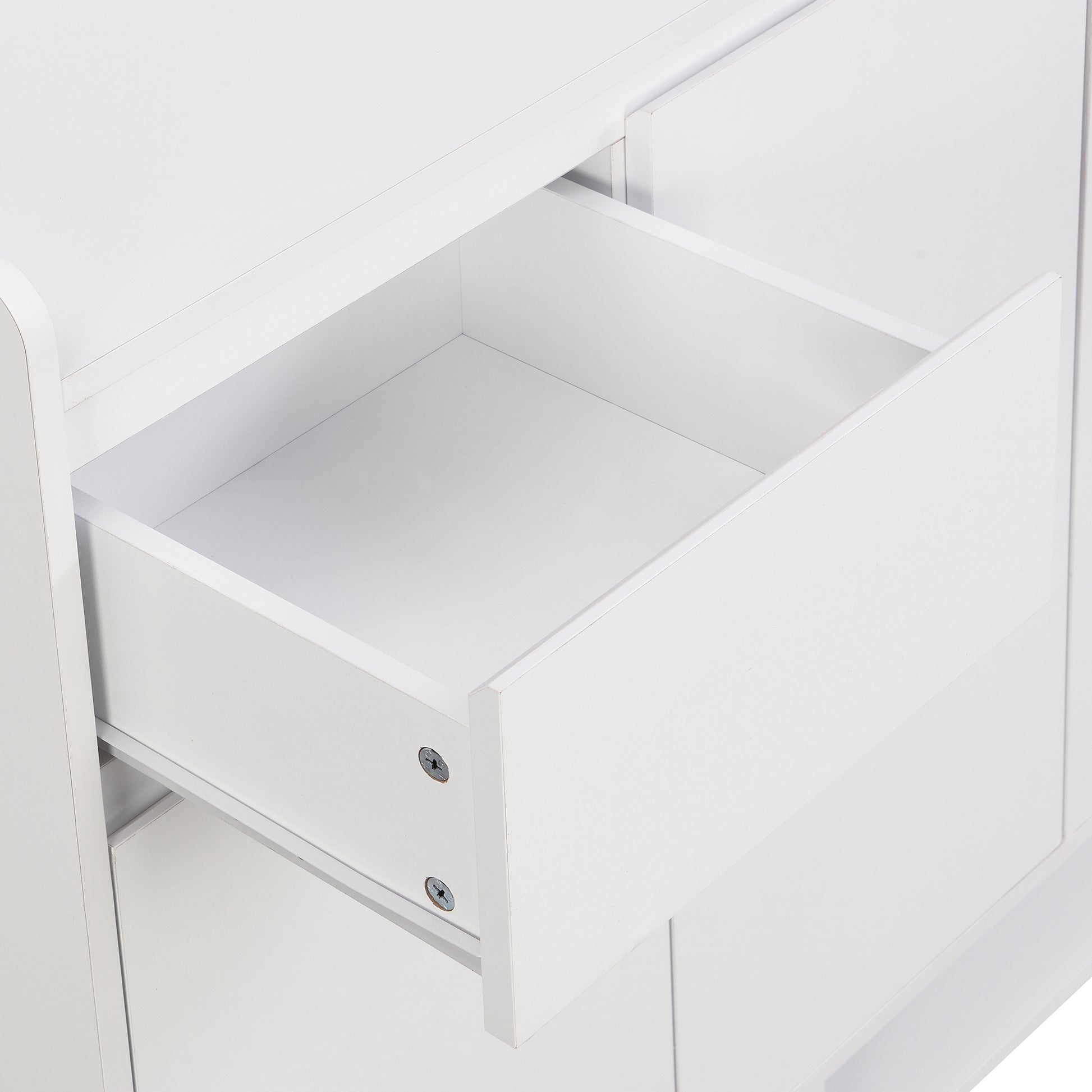 White modern dresser with an open drawer showing its smooth interior
