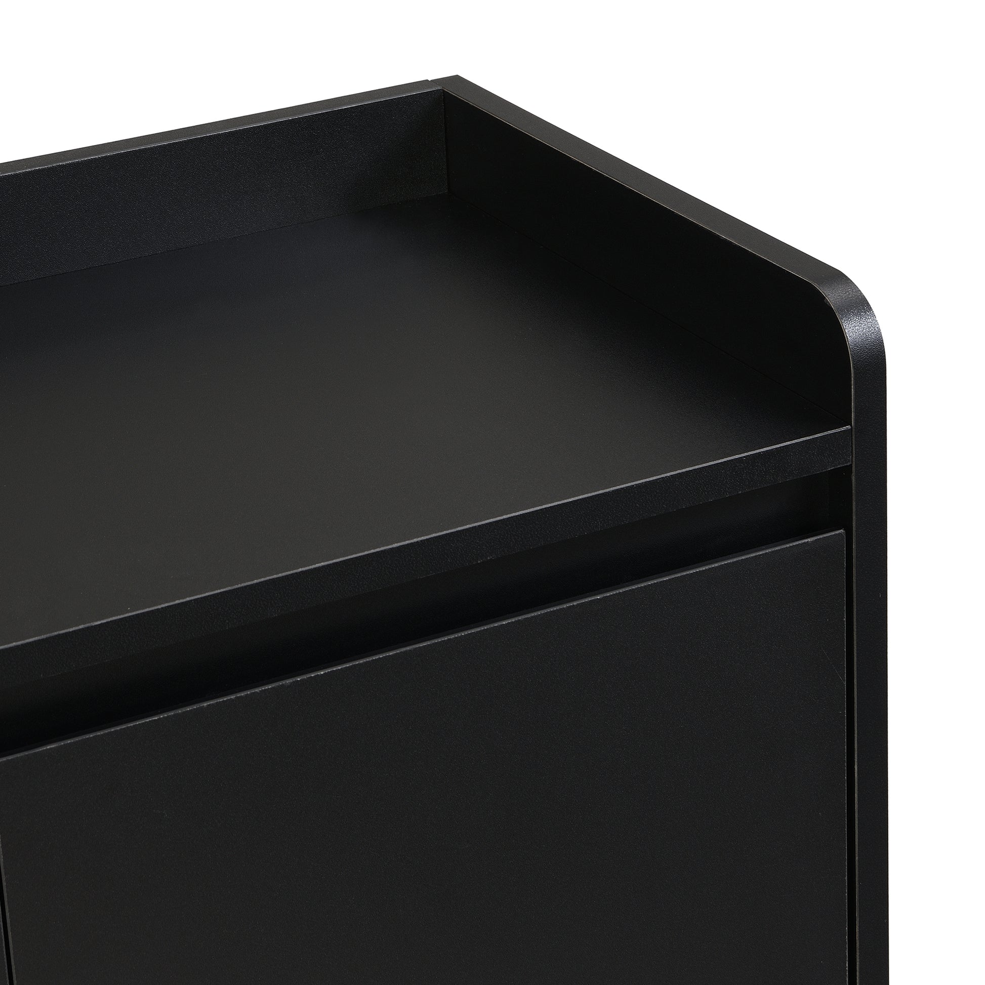 Closeup of a modern black entryway bench with a textured finish and clean lines
