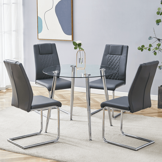 Modern glass top dining table with four grey faux leather chairs