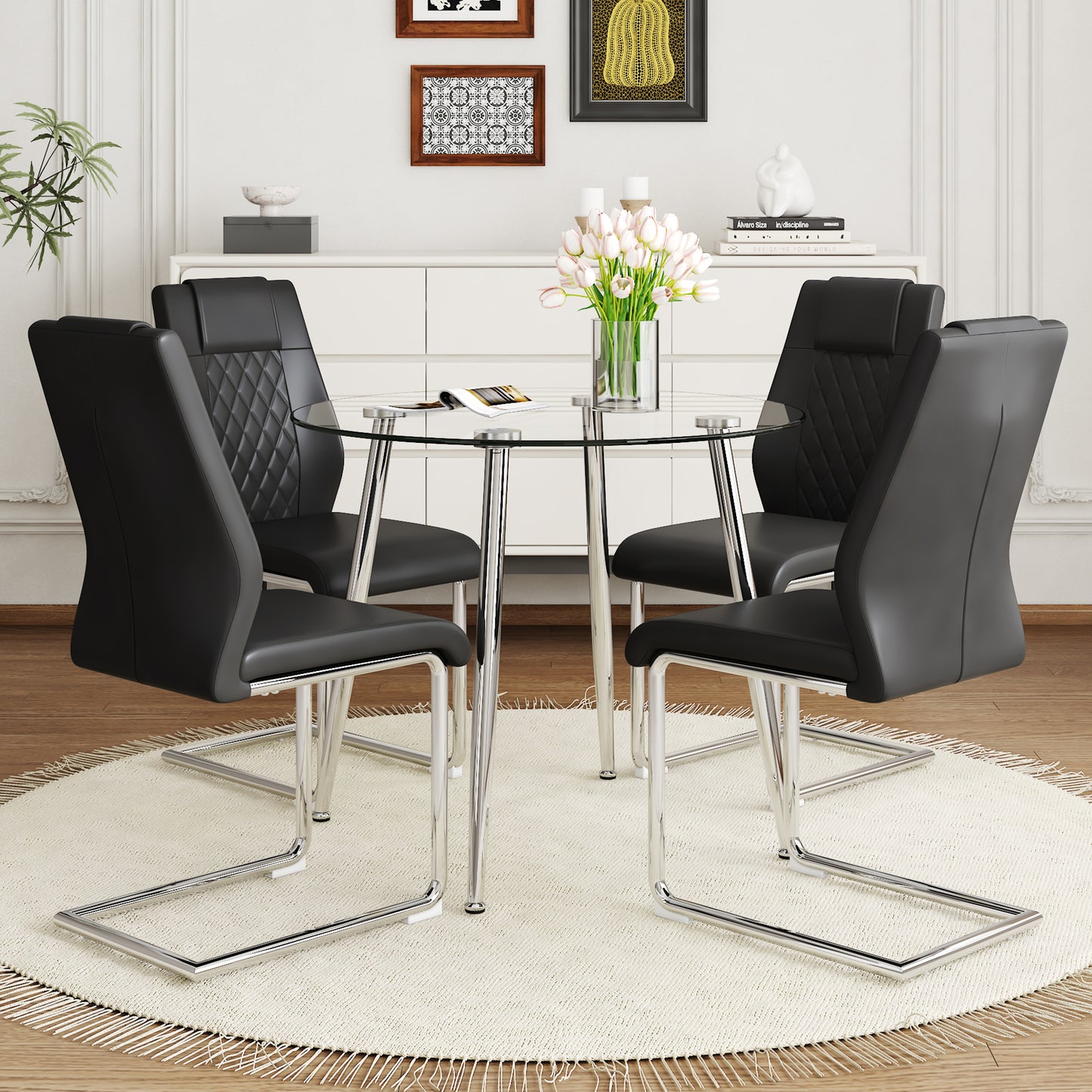 Black upholstered dining chairs with quilted backs around a glasstop dining table