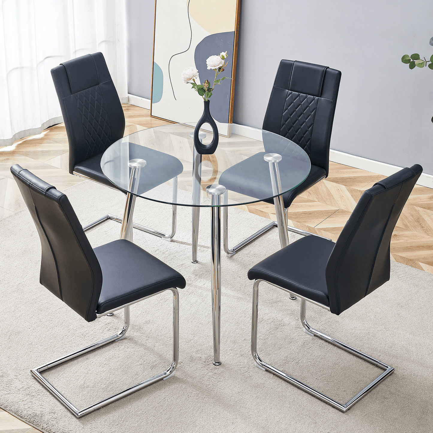 Black faux leather dining chairs with diamond stitching around a clear glass dining table