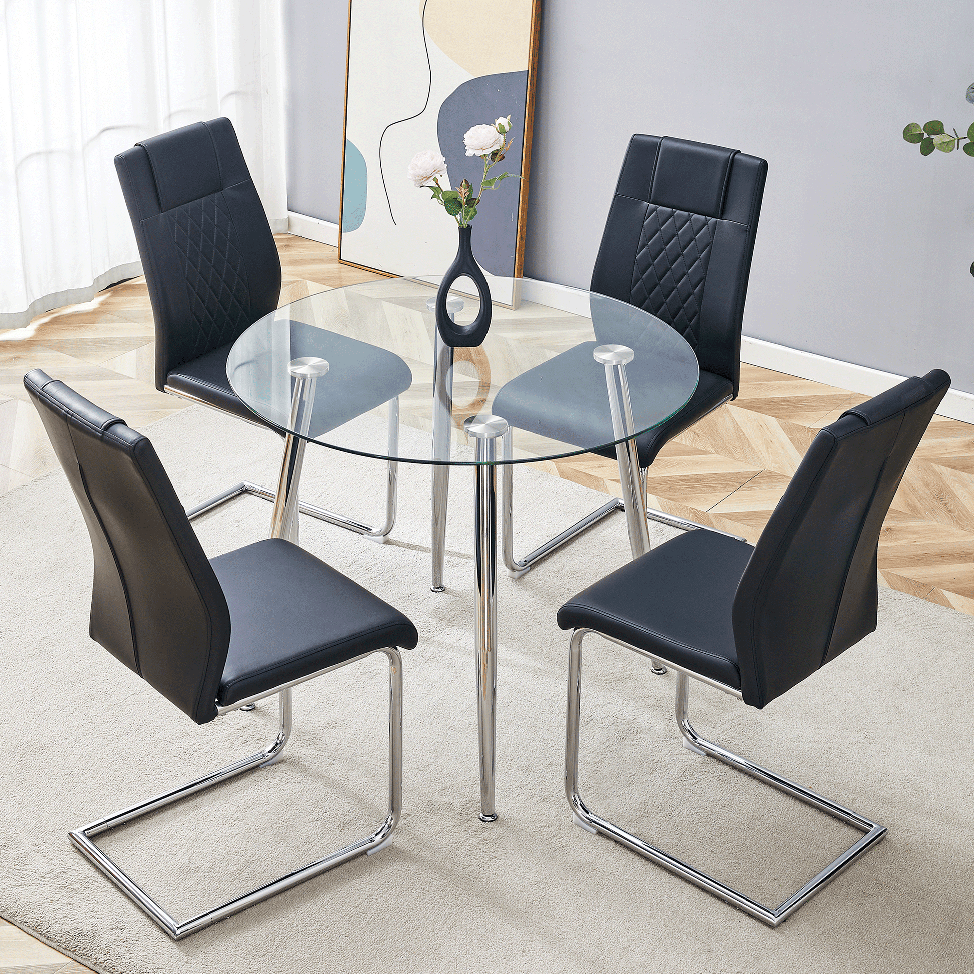 Black faux leather dining chairs with diamond stitching around a clear glass dining table