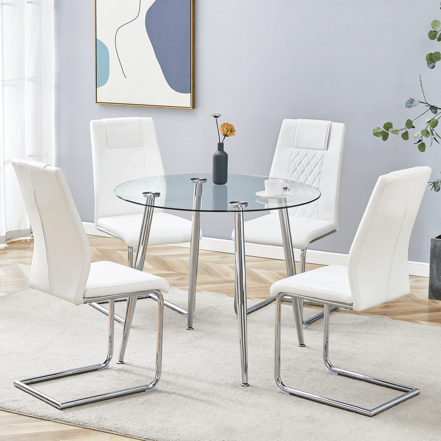 Modern white leather dining chairs around a clear glass table