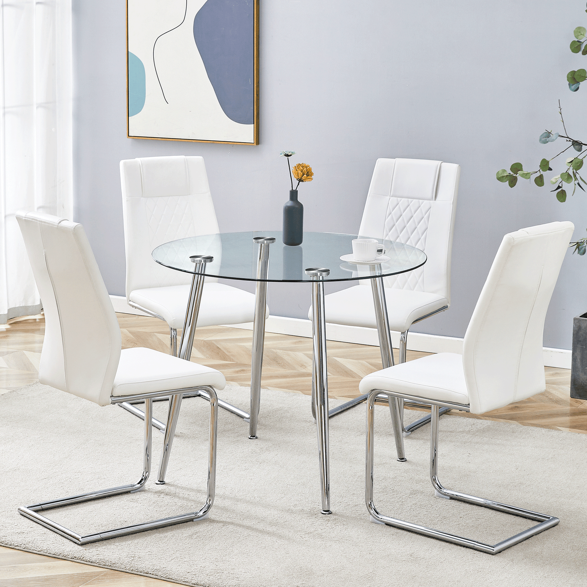 Modern white leather dining chairs around a clear glass table