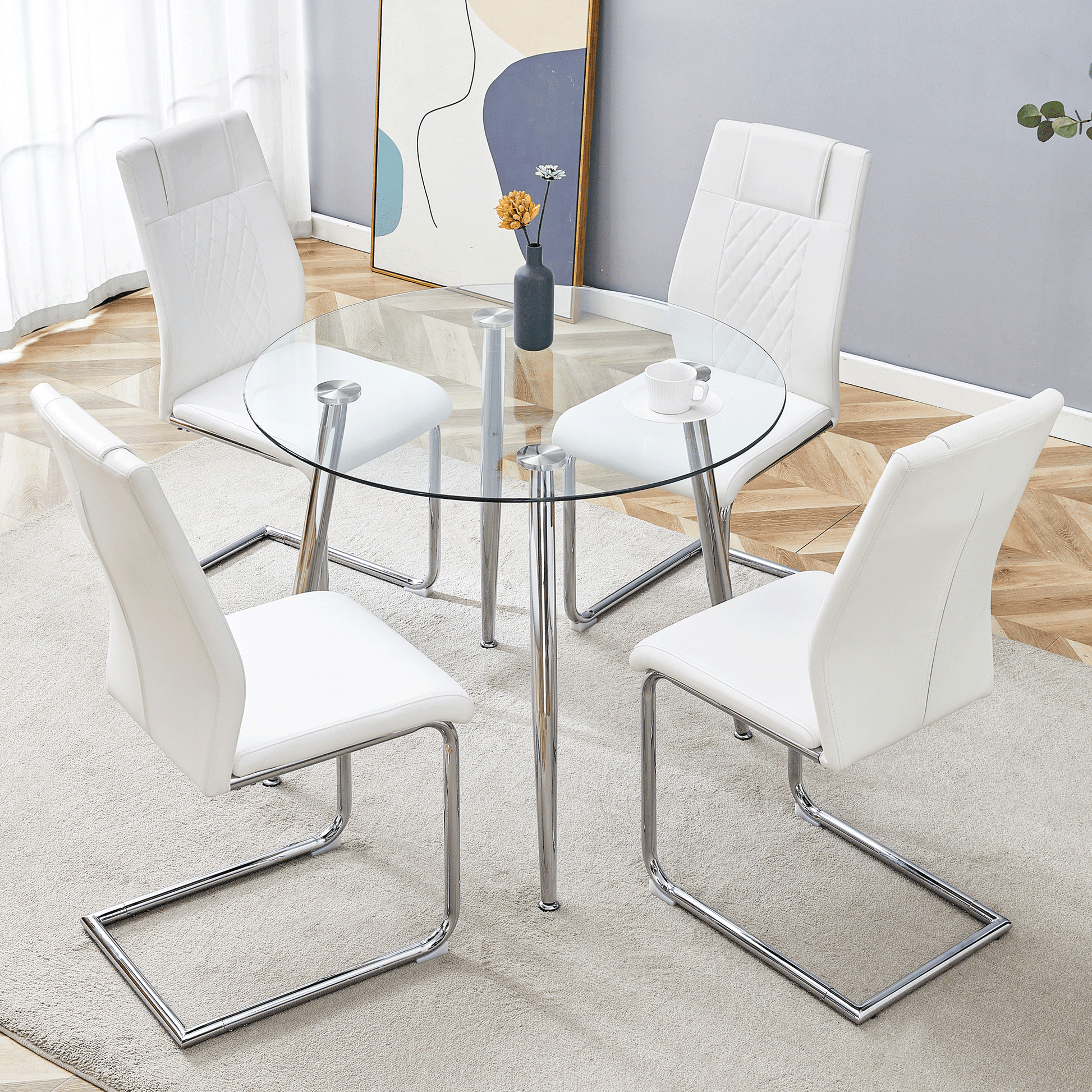 White faux leather dining chairs with chrome legs surrounding a clear glass round dining table