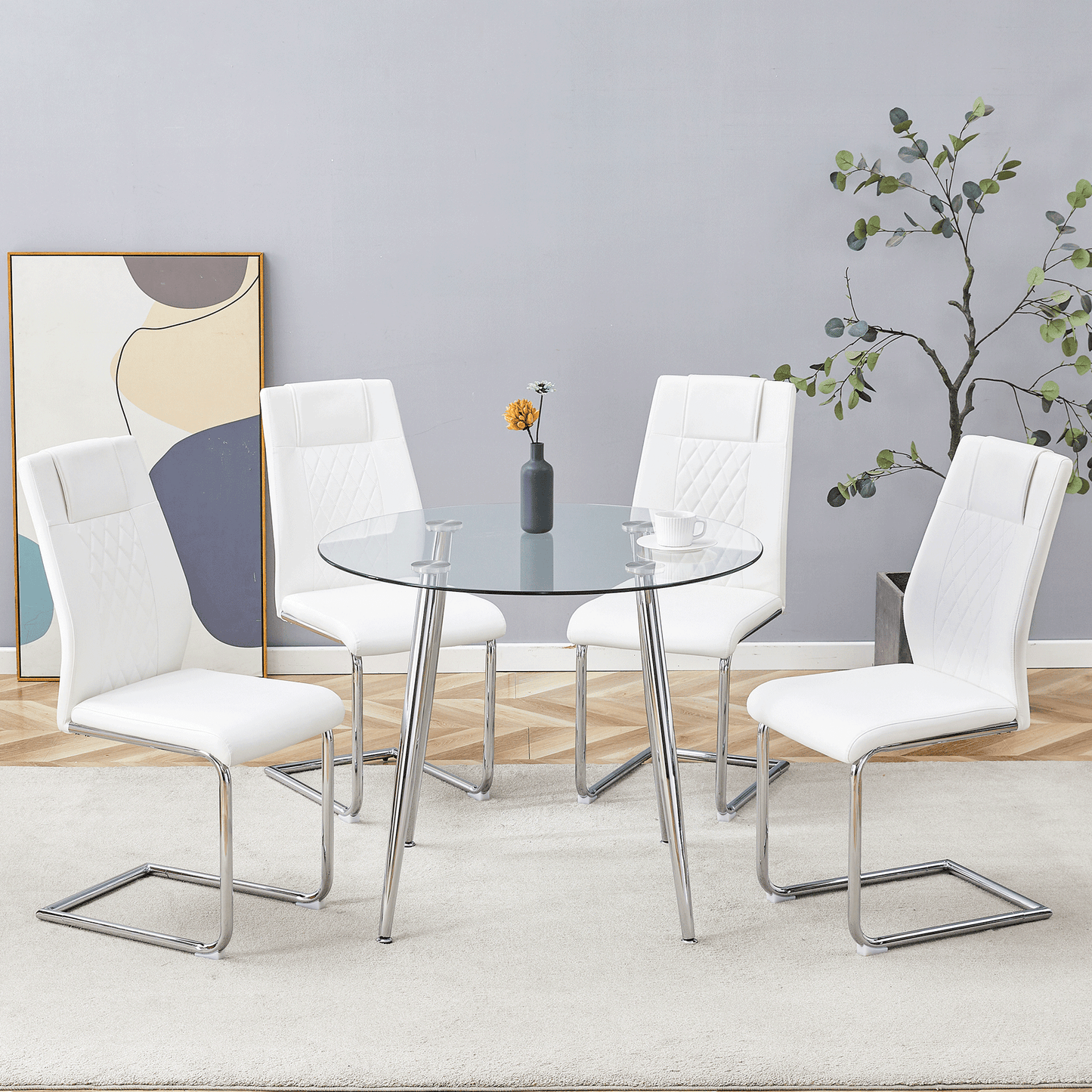 White leather dining chairs with diamond stitching surround a round glass table with chrome legs