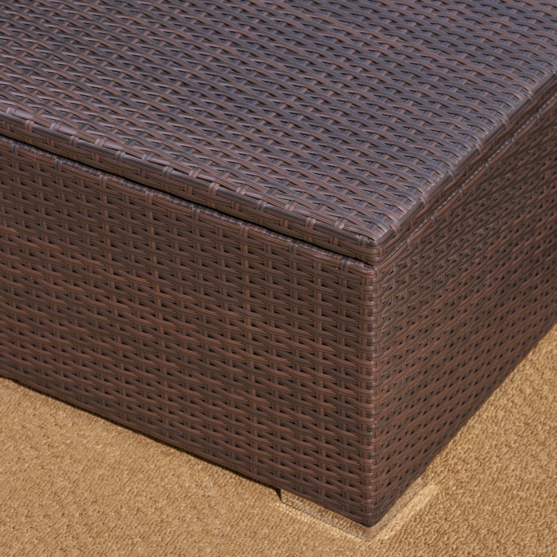 Brown wicker storage bench detail with textured lid