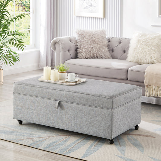 Gray fabric storage ottoman with casters