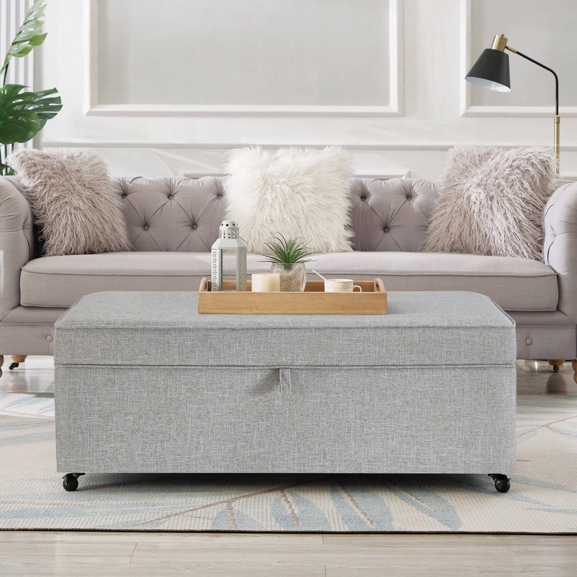 Grey fabric storage ottoman with wheels