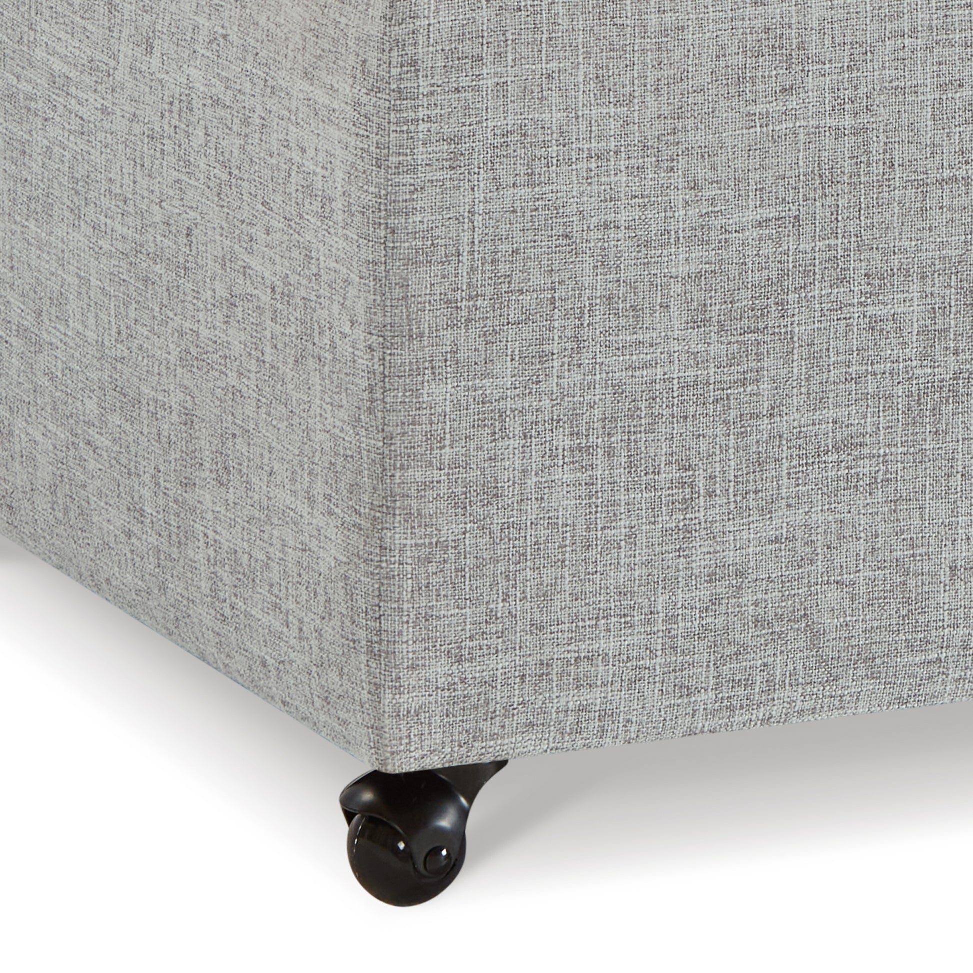 Grey linen fabric ottoman with black caster wheels