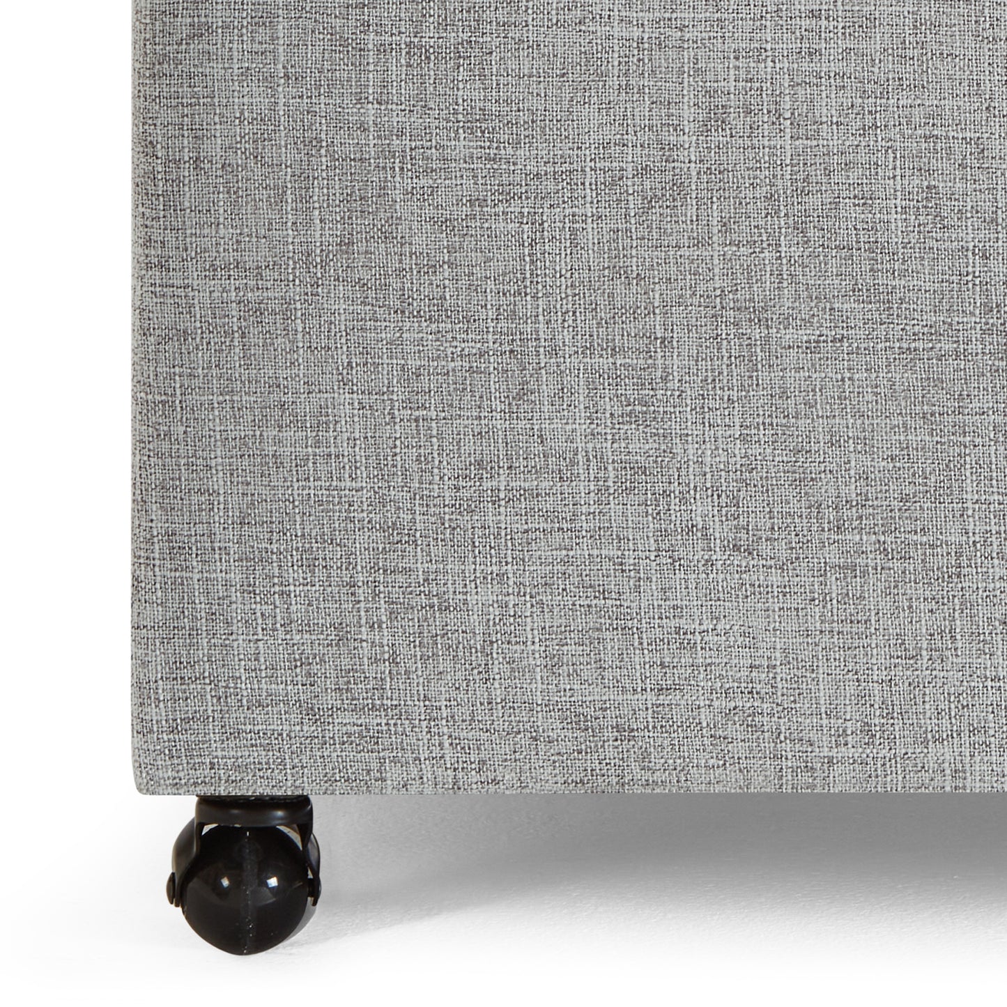 Gray fabric bed frame base with visible casters
