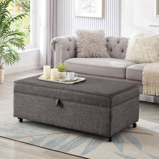 Dark gray fabric storage ottoman with wheels and a lifttop lid for living room storage