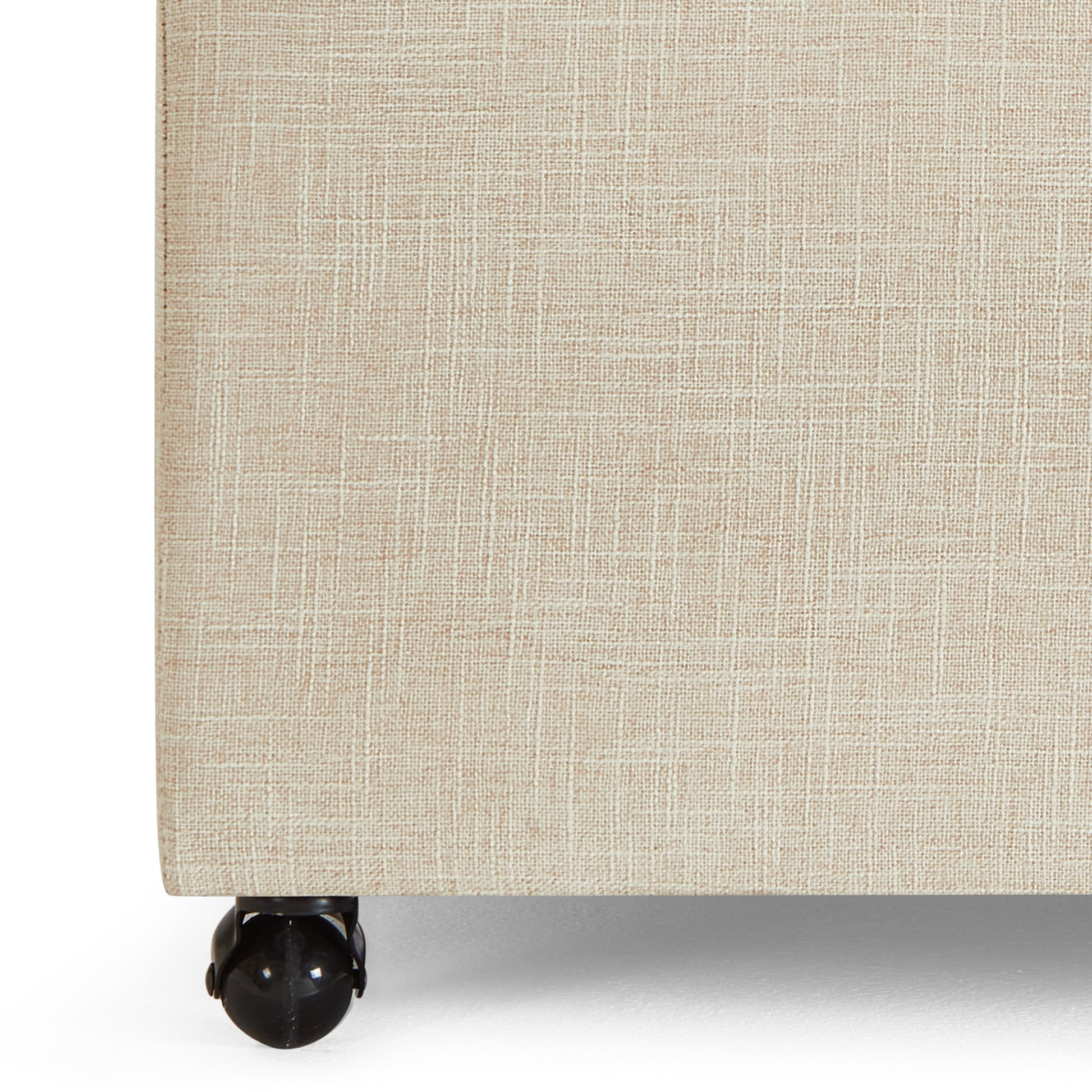 Beige linen upholstered divan base with twin black casters