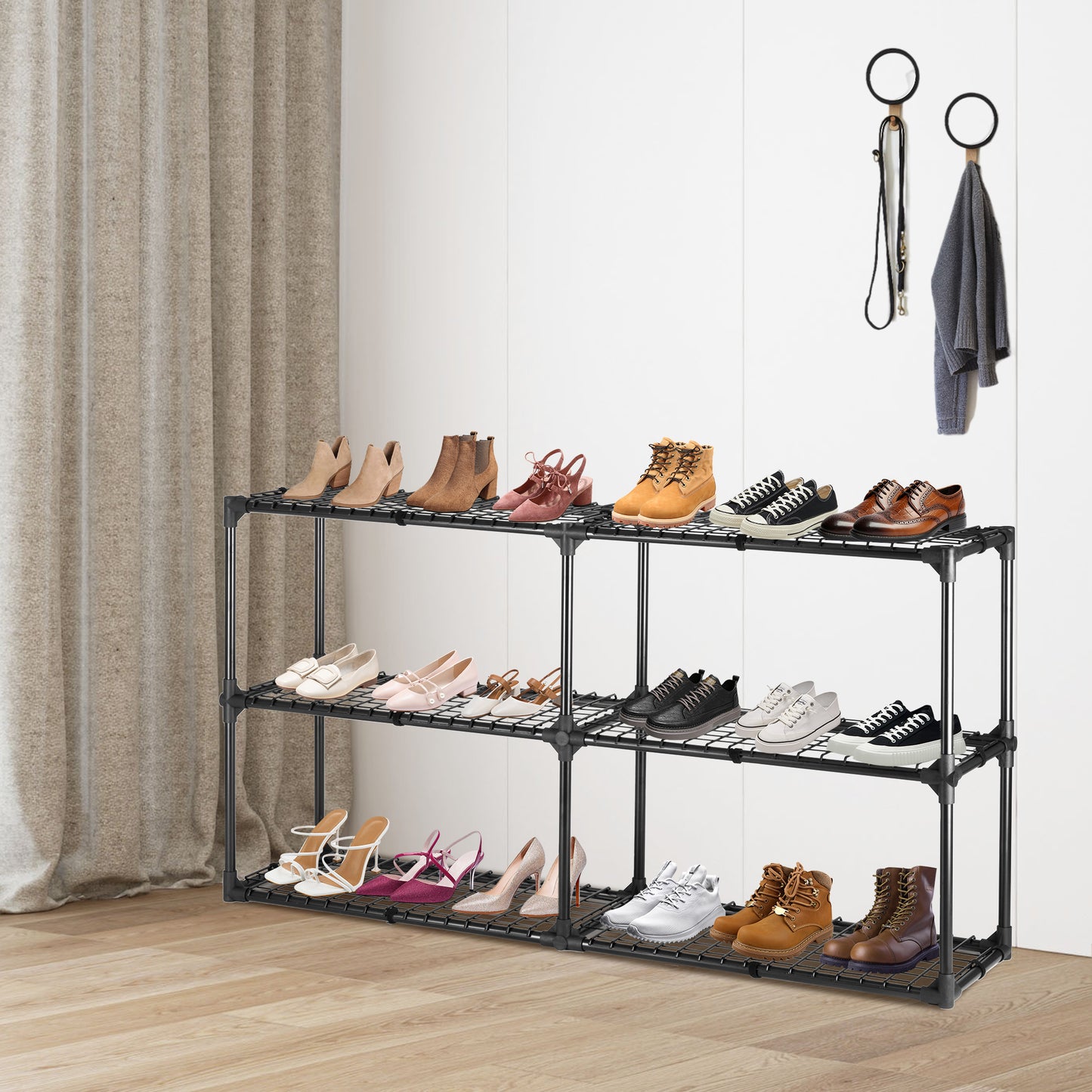 Beige suede ankle boots on a black shoe rack