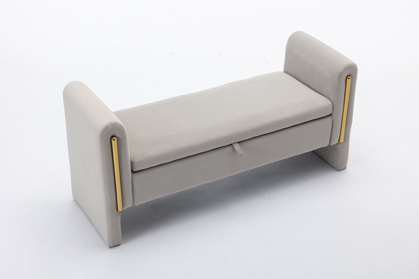 Light grey velvet storage ottoman with gold accents and tufted seat