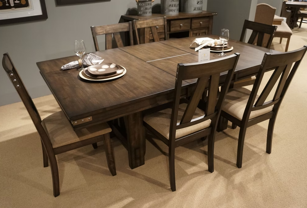 Dark wood dining table with upholstered chairs