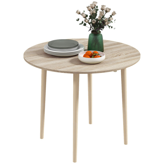 Round oak veneer dining table with tapered wooden legs and set