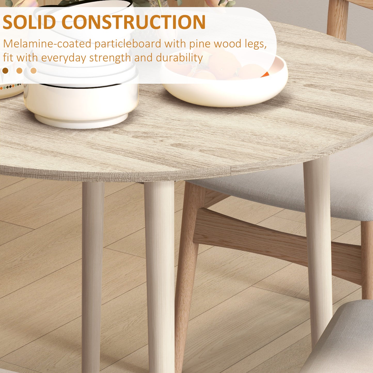 Round dining table with light wood grain finish and solid construction