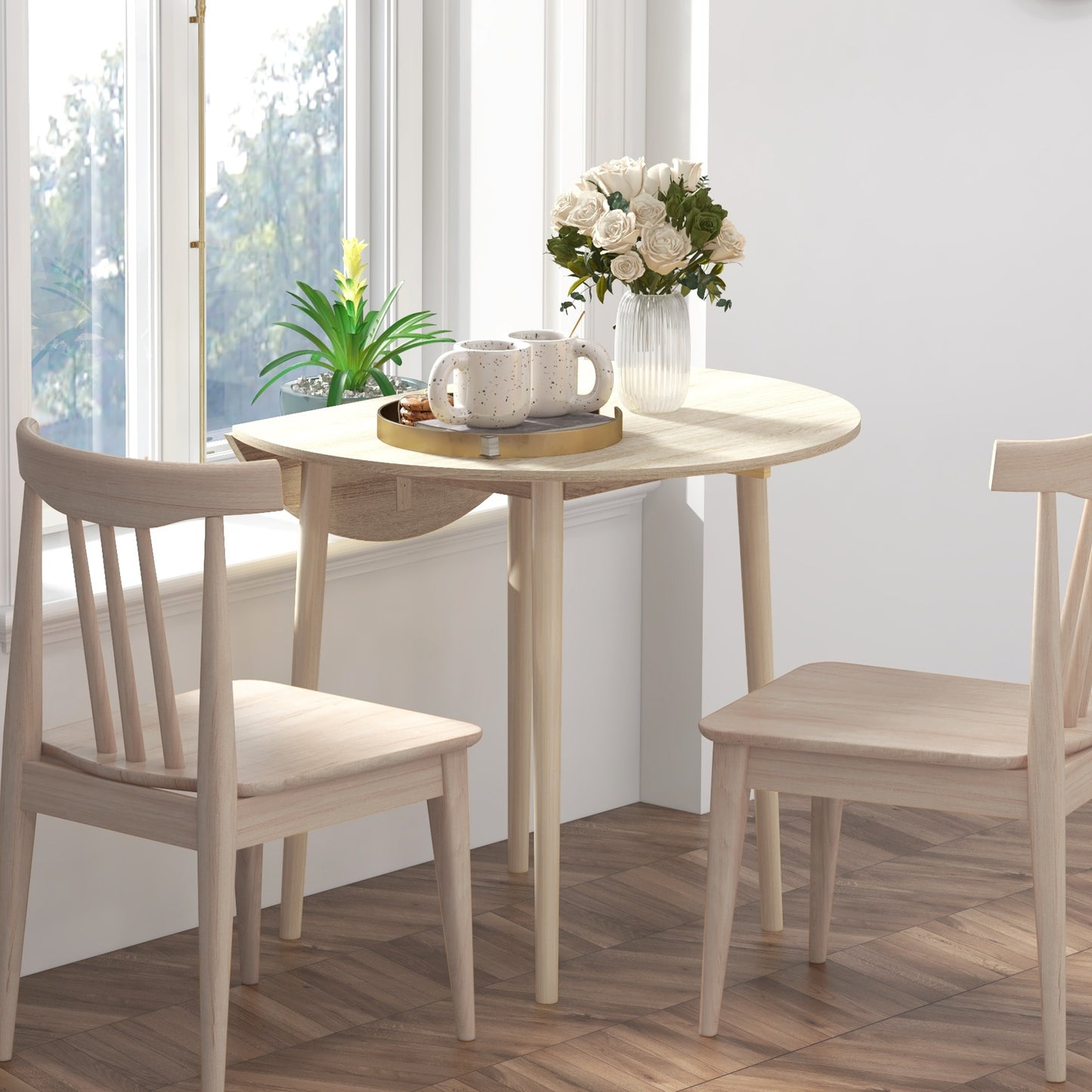Light wood dining set with two chairs and a round table