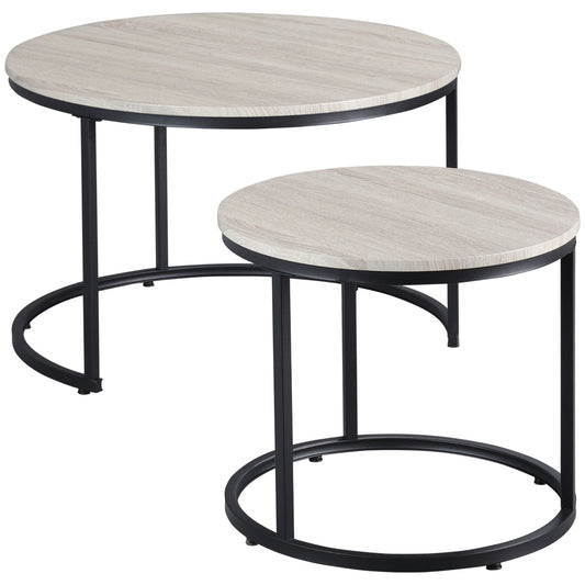 Pair of round nesting coffee tables with light wood grain tops and black metal frames