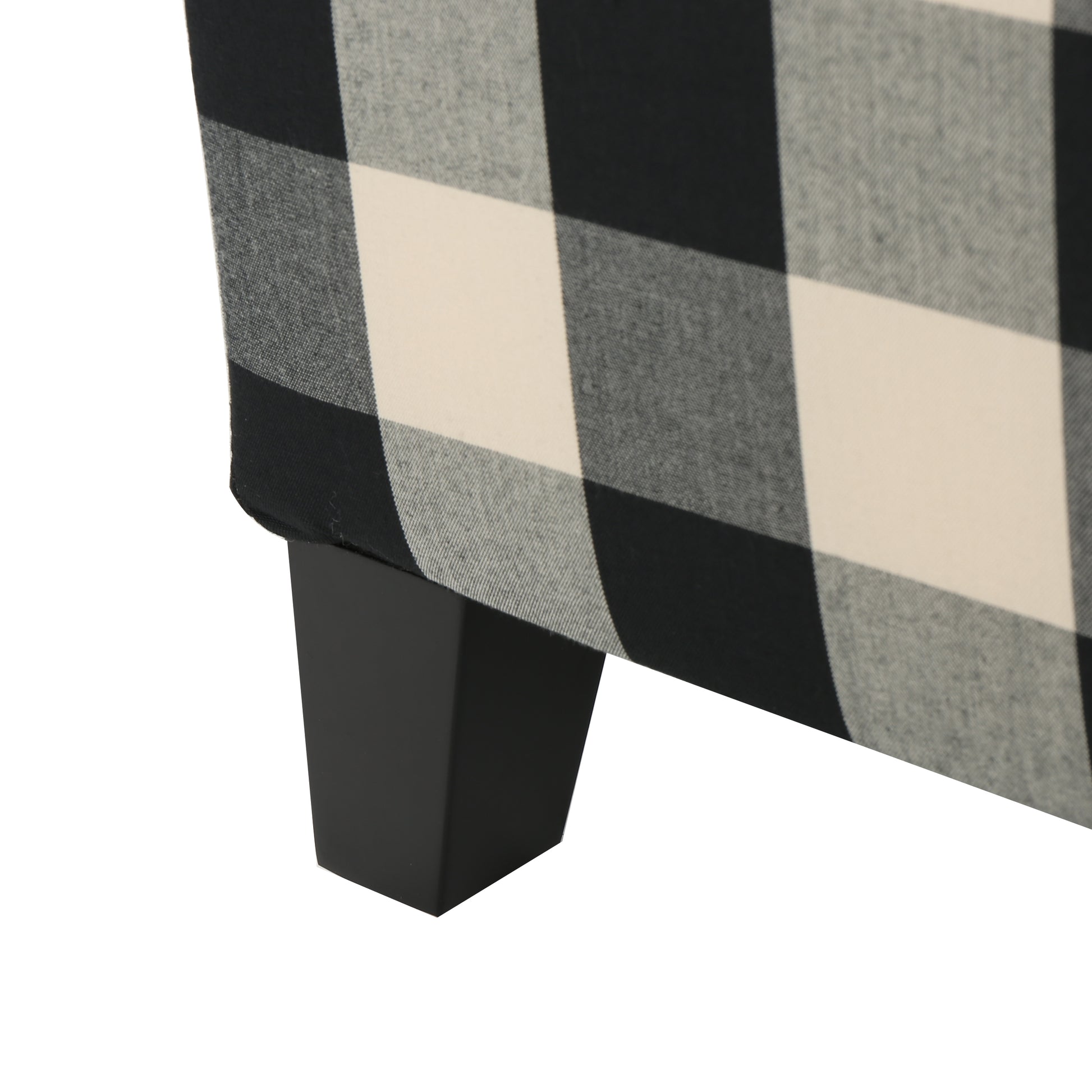 Black and cream buffalo check upholstered accent chair leg