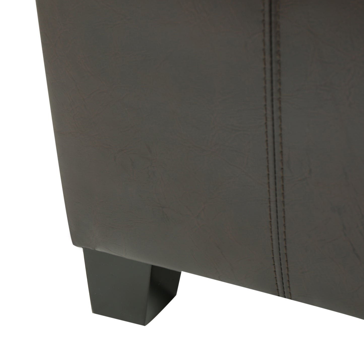 Dark brown faux leather armchair detail with modern black wooden legs