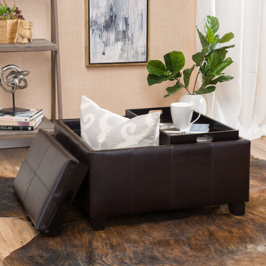 Dark brown faux leather storage ottoman with stitched detailing and open lid