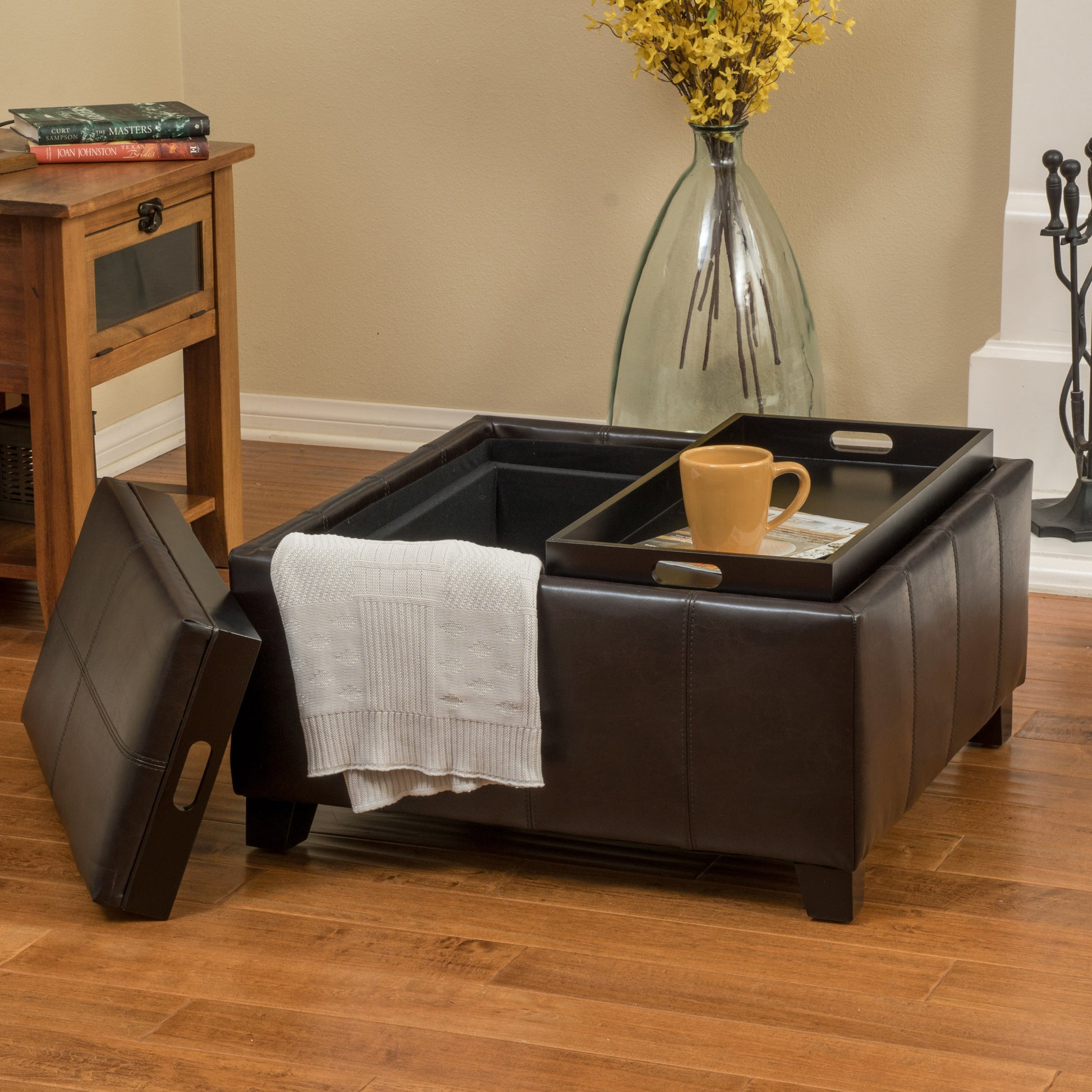 Dark brown leather storage ottoman with tray