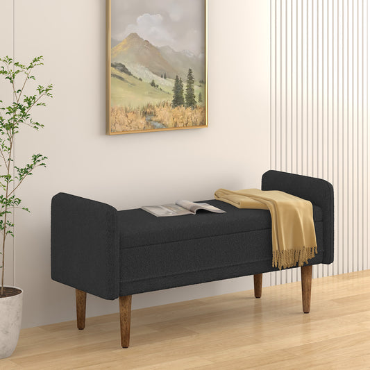 Dark grey fabric storage bench with tufted accents and wooden legs