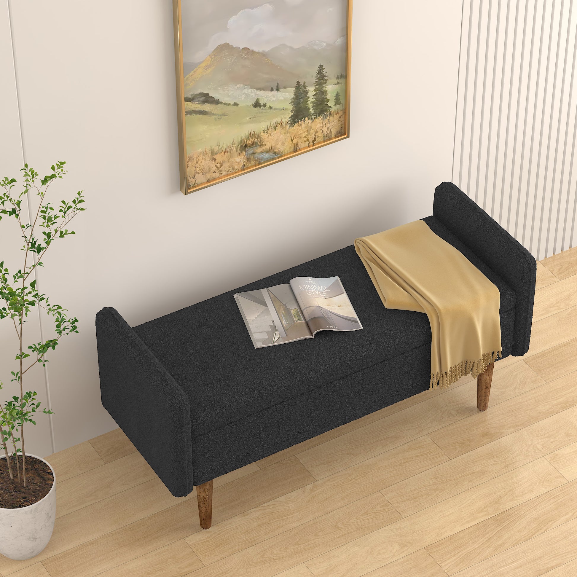 Dark grey fabric storage bench with wooden legs and a folded yellow throw blanket on top