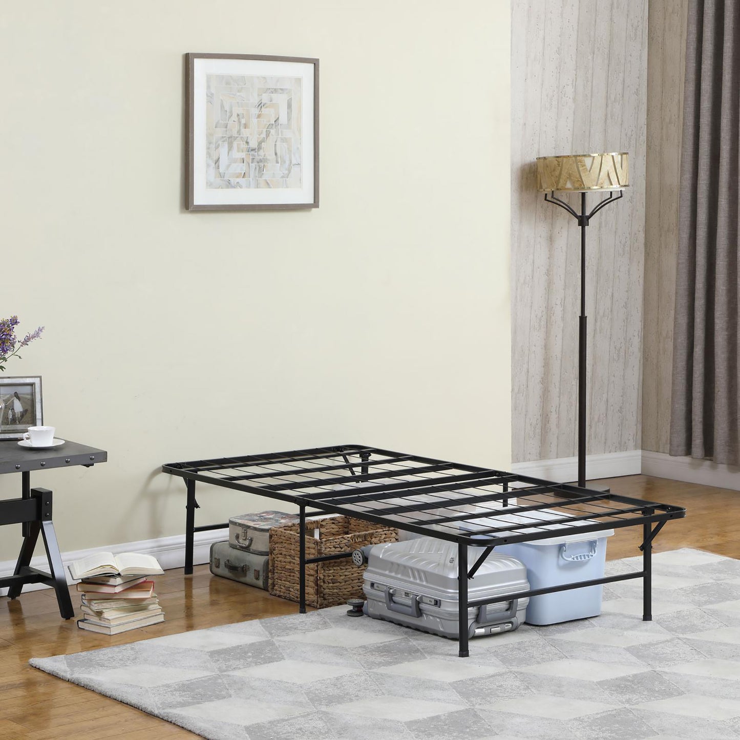Black metal twin bed frame with ample underbed storage space for luggage and bins