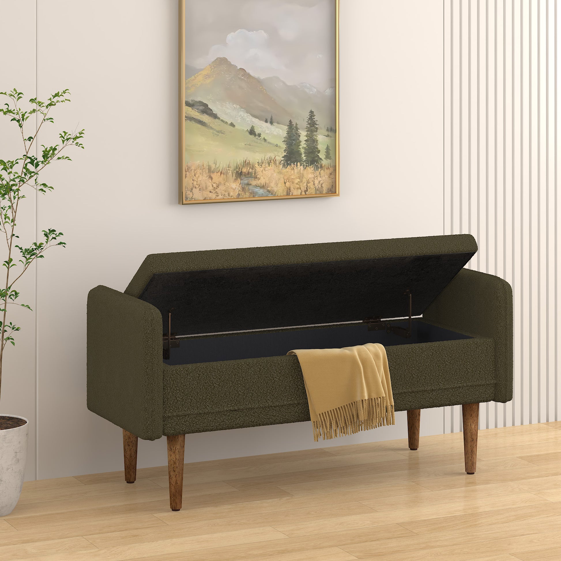 Olive green storage bench with open lid and yellow throw