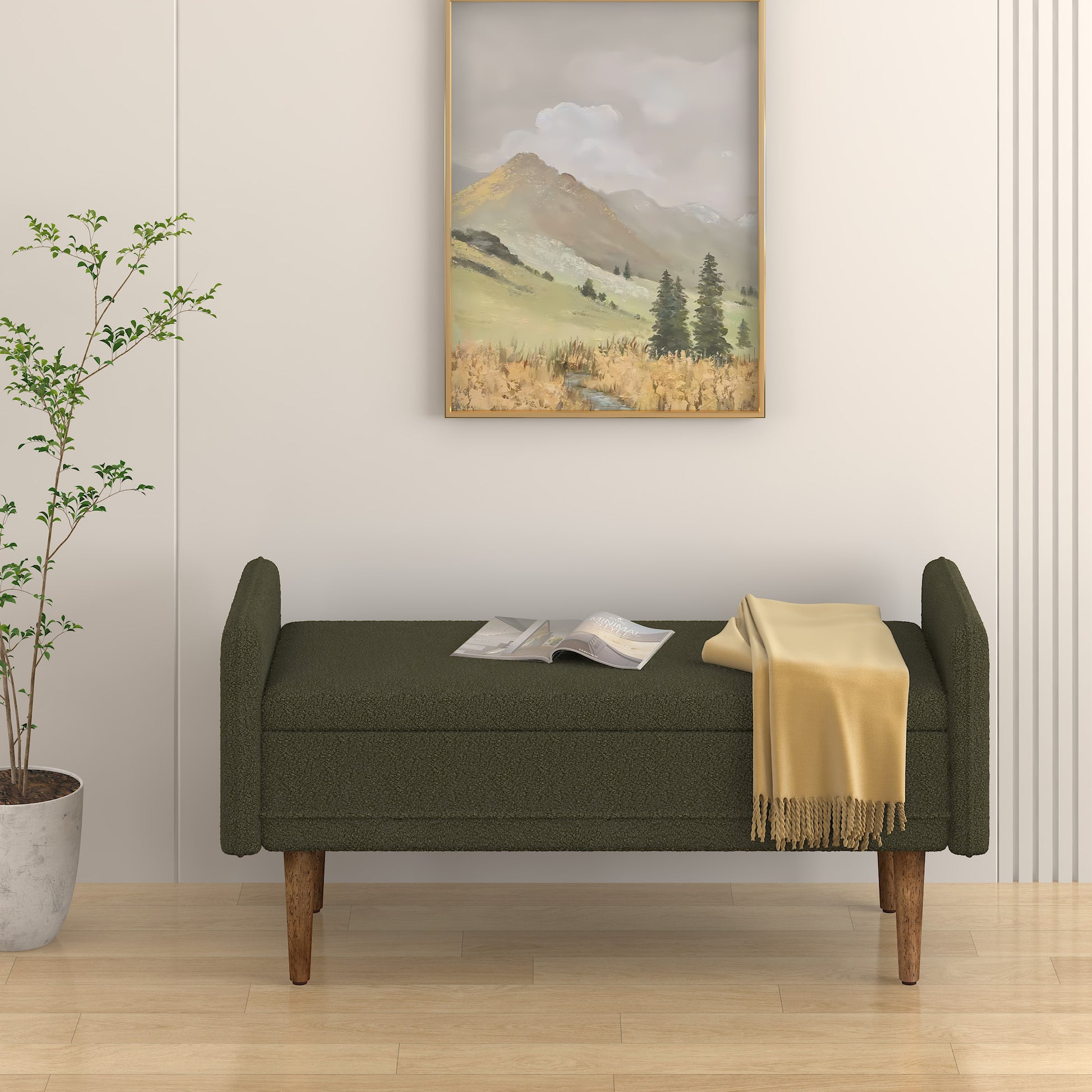 Dark green boucle storage bench with wooden legs and yellow throw blanket