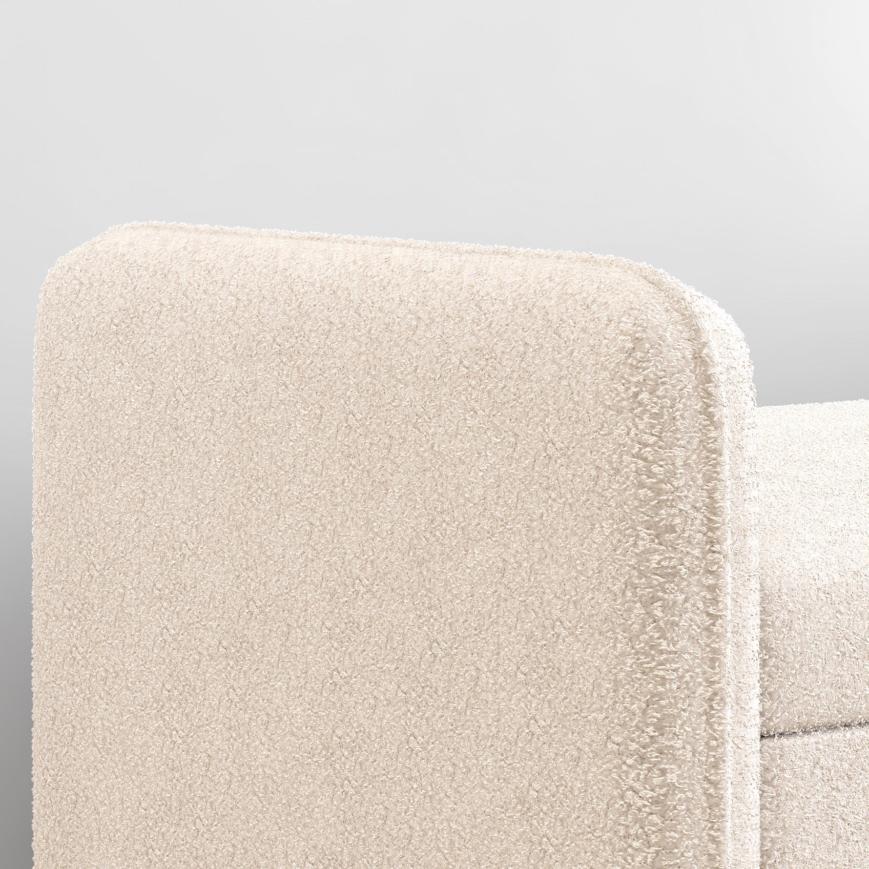 Cream boucle armchair armrest detail