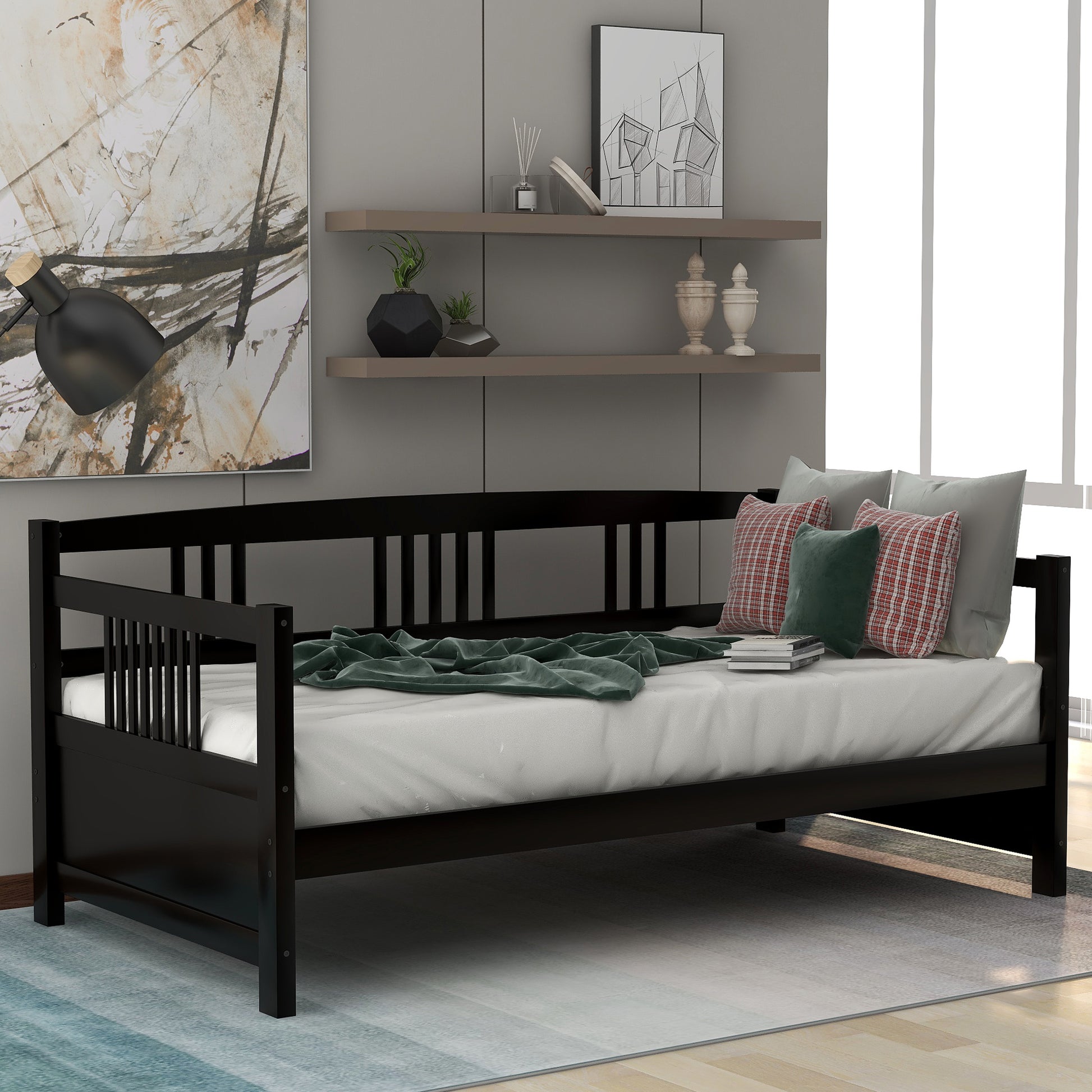 Black wooden daybed with spindle back and white mattress