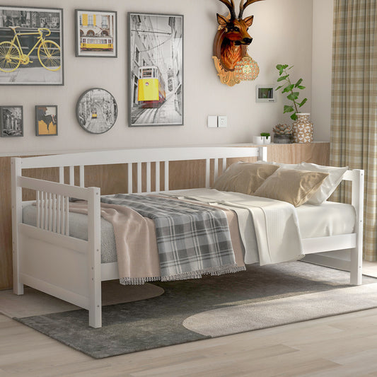 White wooden daybed with plaid blanket and pillows