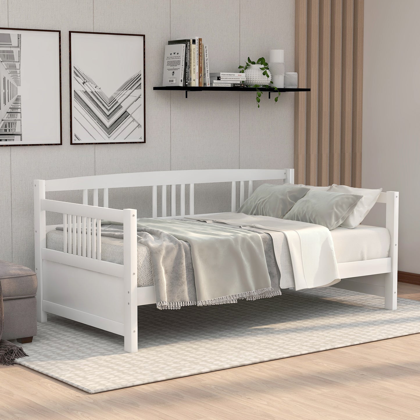 White wood daybed with slatted sides styled with plush pillows and blankets for a comfortable sitting or sleeping space